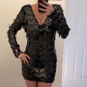 Body con black dress with ornate detail. The perfect party dress!